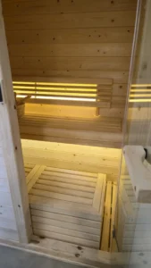 Warm back-lit wood panel, sauna installation Johannesburg.