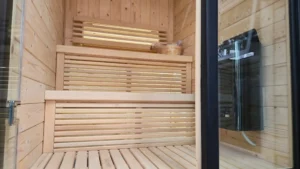Wooden benches view through glass door, sauna installation Johannesburg.