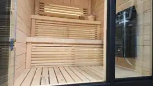 Wooden benches view through glass door, sauna installation Johannesburg.