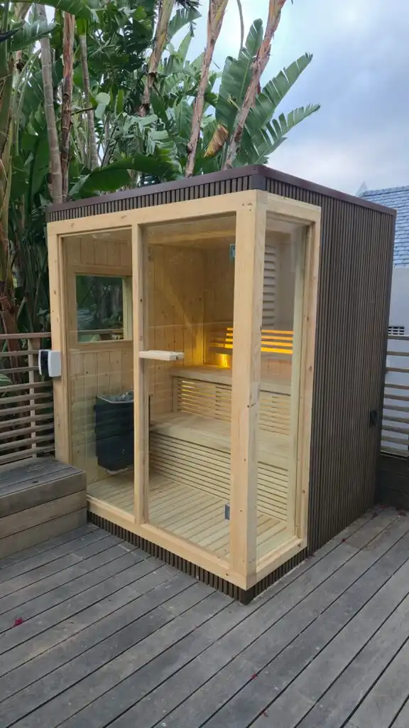 Vertical view of an outdoor glass sauna in Johannesburg.