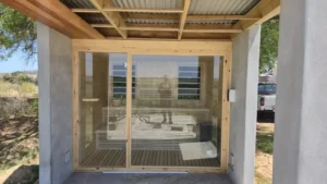 Glass front outdoor sauna installation Johannesburg.